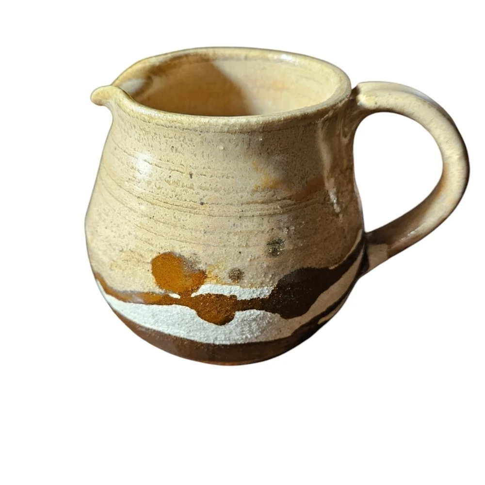 Vintage studio art pottery pitcher signed.